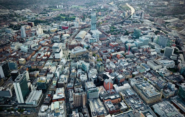 The MAR Legal Blog 11 A stunning aerial photograph of Manchester's vibrant cityscape with iconic architecture.