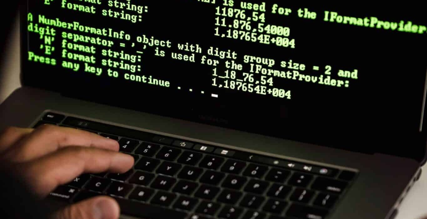 Cyber Security Legal Advice 1 Professional reviewing data protection compliance on a laptop in an office setting