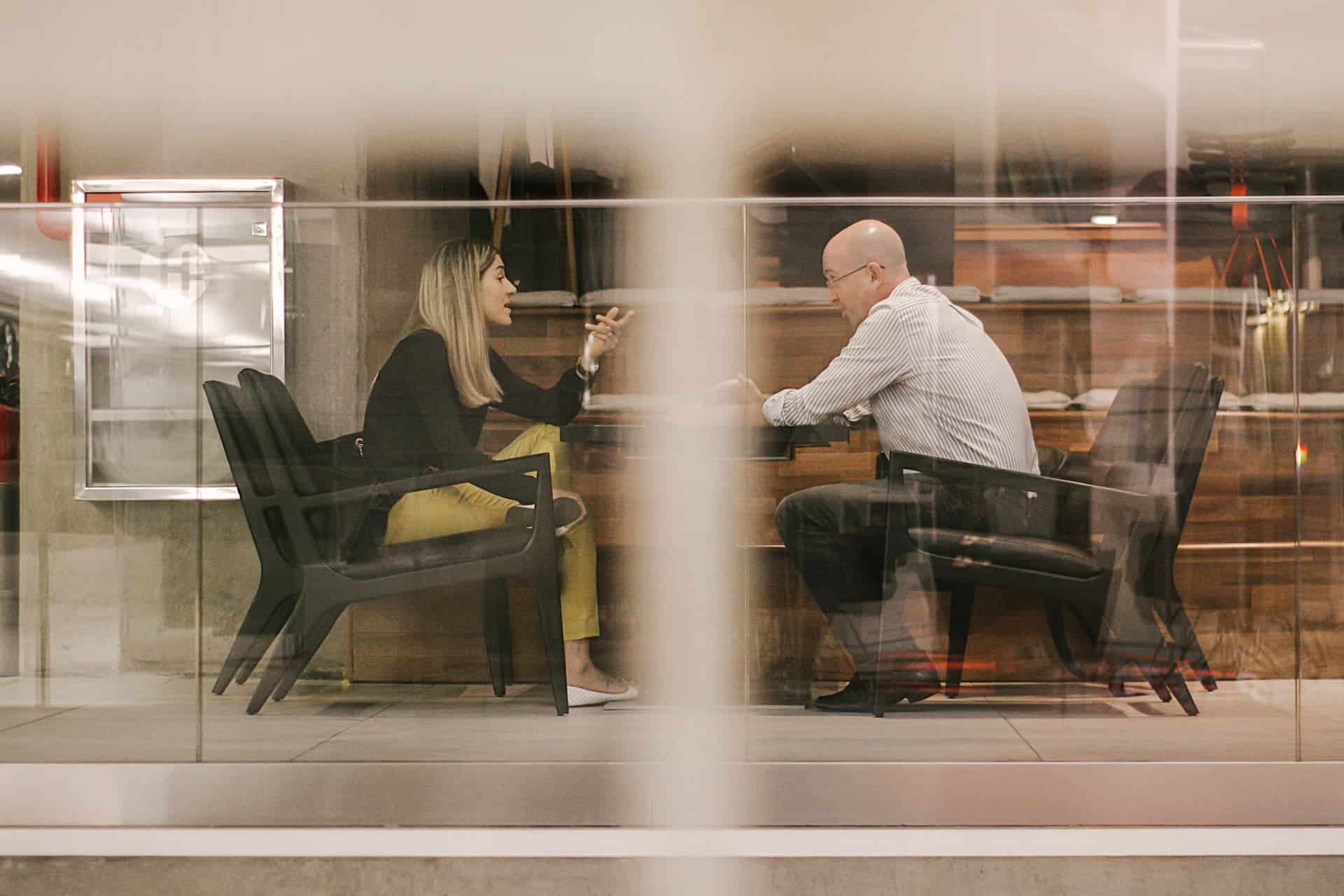 Director dispute solicitors in a boardroom meeting with clients