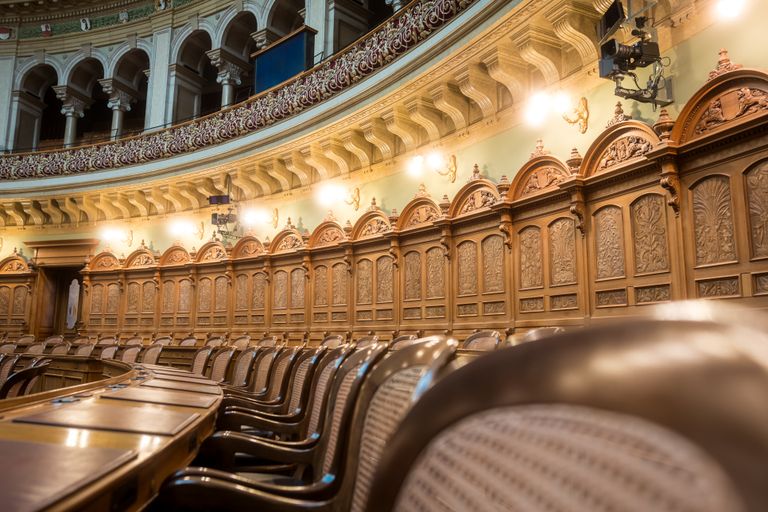 Should You Sign a Settlement Agreement? 7 Important Things to Consider First 11 Interior view of the elegant Swiss Parliament council chamber in Bern, Switzerland.